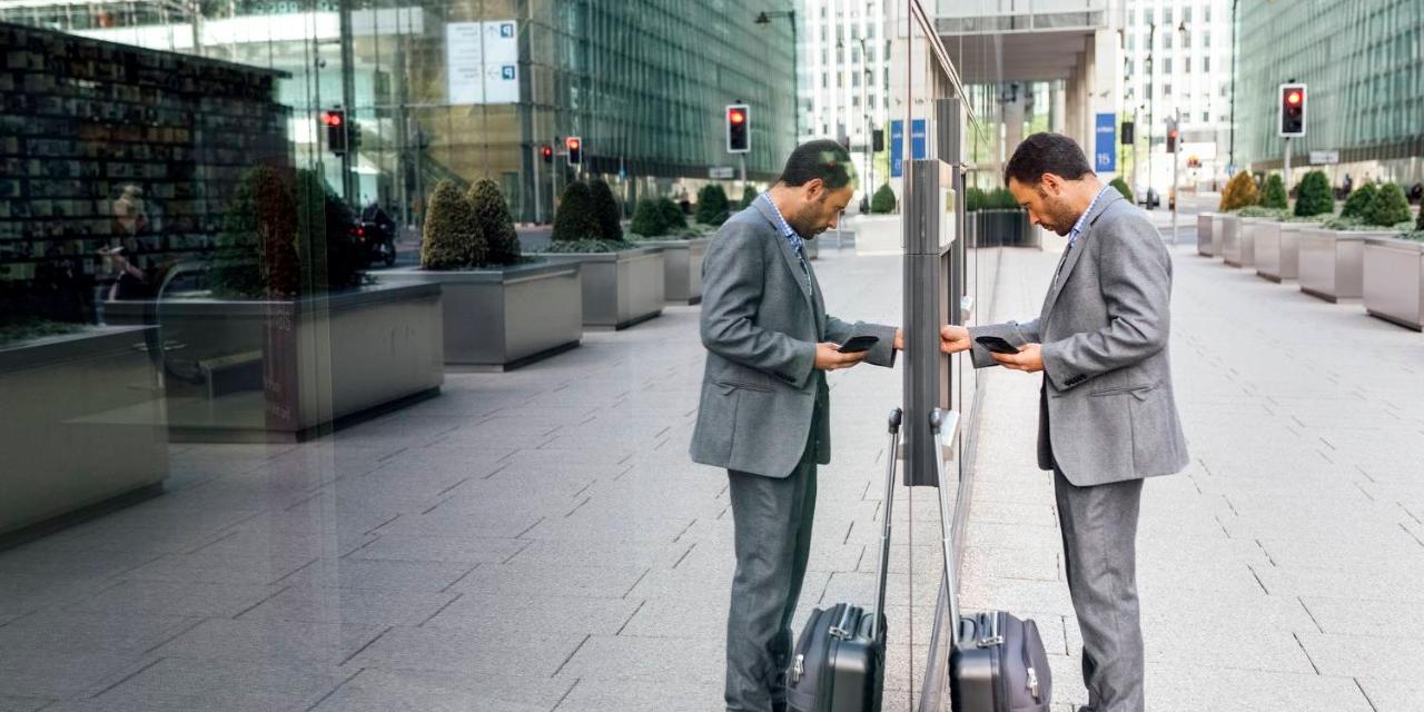 AI in Banking Businessman using ATM outside