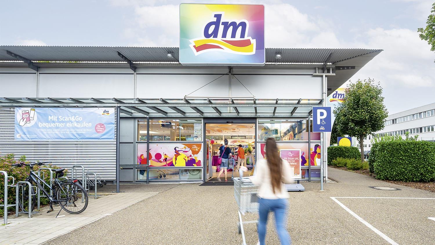 dm storefront with people going shopping dm storefront with people going shopping